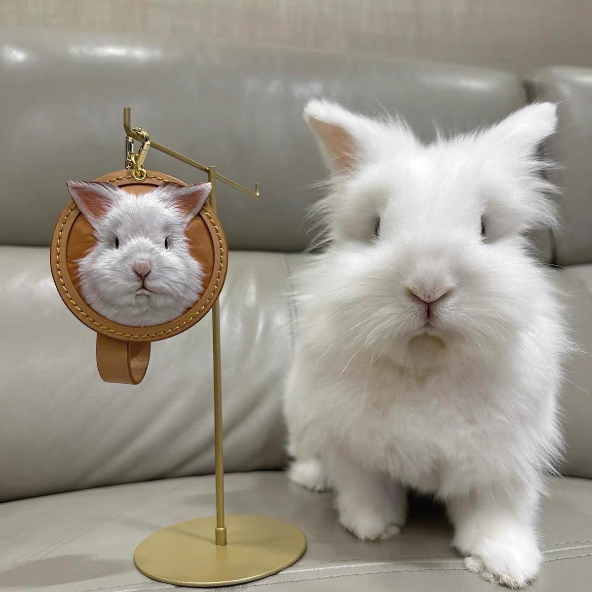 Custom leather rabbit portrait keychain - photo of the pet next to the handmade keepsake from Furry Tales.